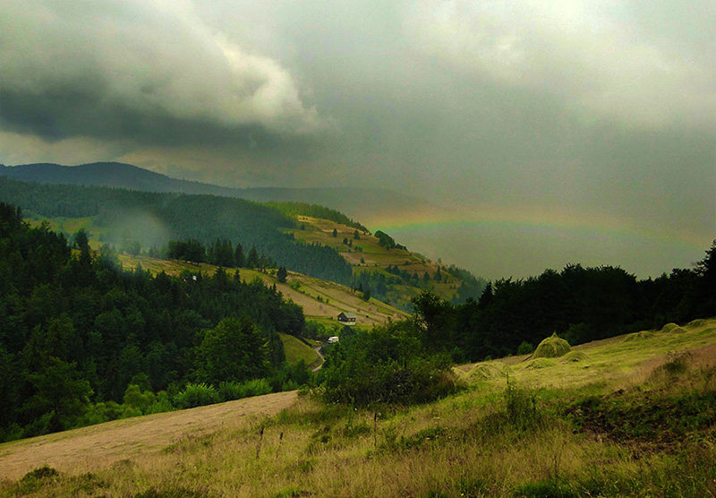 Berglandschaft mit Regenbogen